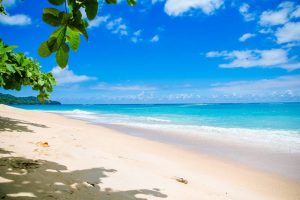 a beach, clear sea waters and blue sky