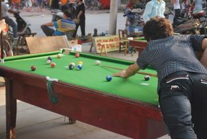 A women playing pool