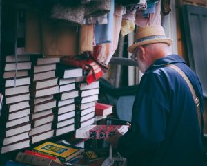 A man inspecting books