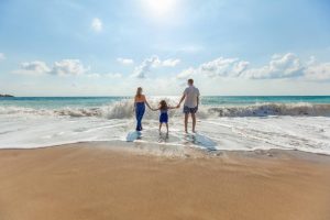 investing in a beach rental- a family on the beach