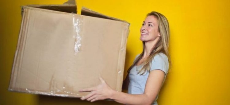 a girl with a moving box
