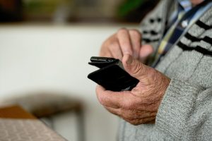 Old man using phone