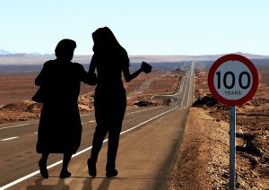 Silhouette of old and young women walking