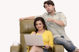 Two friends looking at laptop
