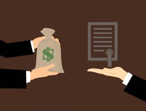 Hands exchanging a money bag