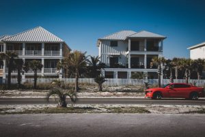 red car parked near building