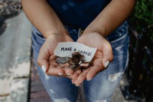 woman showing coins