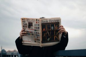 person reading newspapers