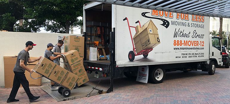 Long distance movers Florida team loading a truck