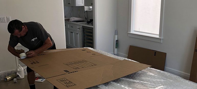 A mover protecting and packing an item