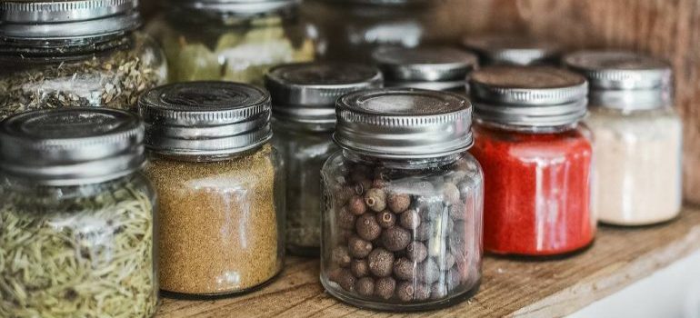 Organizing and preparing glass jars for relocation.