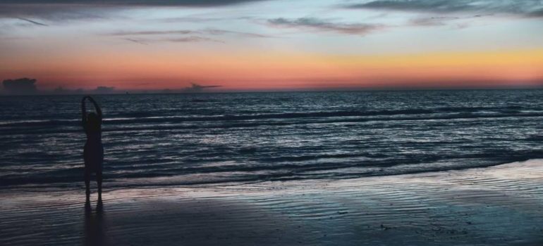 woman on a beach on sunset