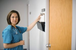 a nurse looking at the health records