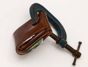 a wallet squeezed