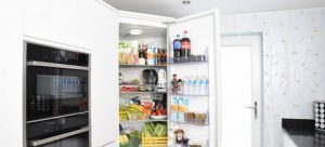 Open fridge with food and drinks in it