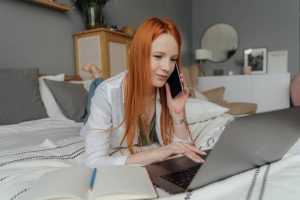 A woman talking over the phone