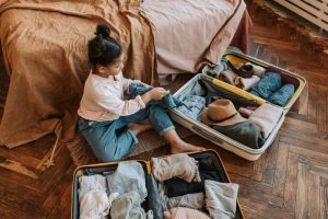 A girl packing a suitcase