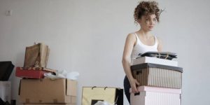 A woman carrying boxes