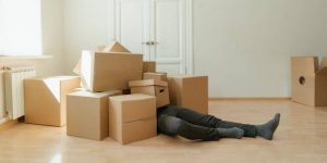 A man under many boxes