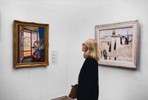A woman looking at artwork