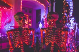 Two skeletons under the neon lights