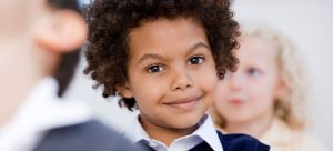 a boy in school smiling