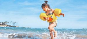 a child playing on a beach in miami