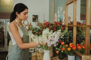 A woman taking care of flowers