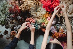 A woman takign care of the flowers