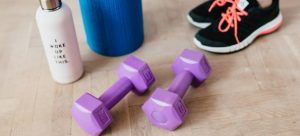 yoga mat and weights on the floor