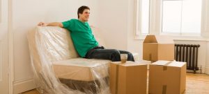 man satisfied after his neighbors helped him pack