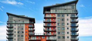 A residential building with bright blue sky in the background