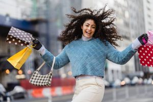 A girl happy trying to plan a ladies' weekend after moving to Miami