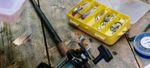 Fishing equipment on a wooden desk