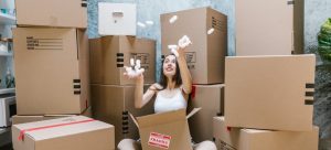 a woman hacing fun while packing