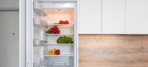 Open fridge with groceries inside