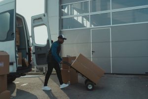A mover unloading moving boxes
