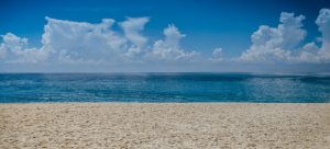 a sandy beach and an ocean