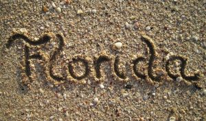 Name of Florida written in the sand.