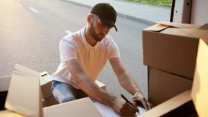 mover inspecting the moving cargo