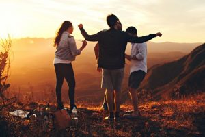 four friends having fun outdoors