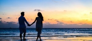 a couple on the beach in one of the top destinations in South Florida
