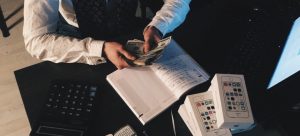 a man calculating the cost of hiring Miami movers