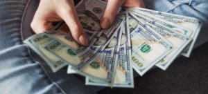 Person holding a lot of money