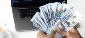 man holding money in one of the best Florida cities for low-income families