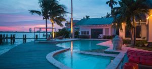 a house with a pool and a beach