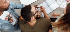 people in the office working on to expand family business to Miami in 2022