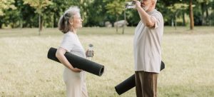 two persons drinking water and talking about best places for seniors in Florida