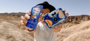 a man showing sunscreen while thinking about the most common questions about moving to Miami