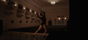 a woman dancing in theater